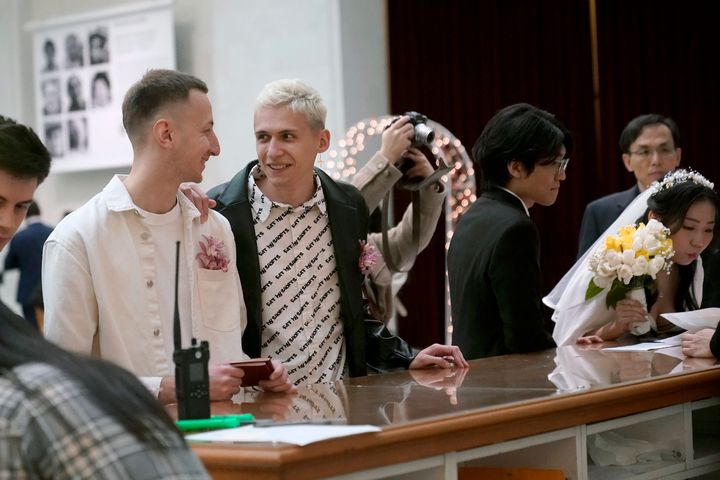 Viktor Staroverov (left) and Iurii Sigarev fill out paperwork to marry on Feb. 14, 2023, at City Hall in San Francisco. On Nov. 5, California voters will decide on a state constitutional amendment to protect the right to same-sex marriage.