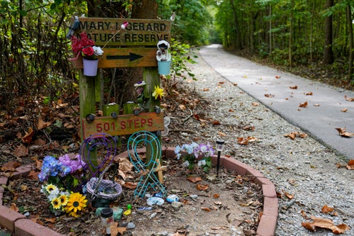 Decorated stones bearing the names of Abigail Williams and Liberty German, who were killed in February 2017, are placed at a memorial along the Monon High Bridge Trail in Delphi, Indiana, on Oct. 1. 