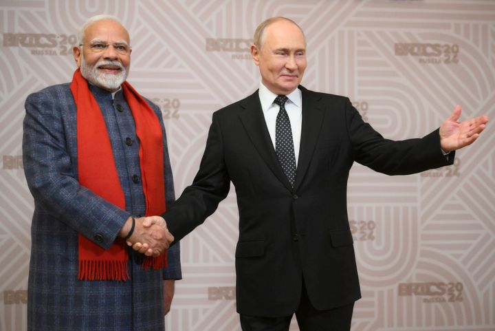 Russian President Vladimir Putin, right, and Indian Prime Minister Narendra Modi shake hands during the welcoming ceremony prior to an informal dinner on the sidelines of BRICS Summit at Kazan City Hall in Kazan, Russia, Tuesday, Oct. 22, 2024. 