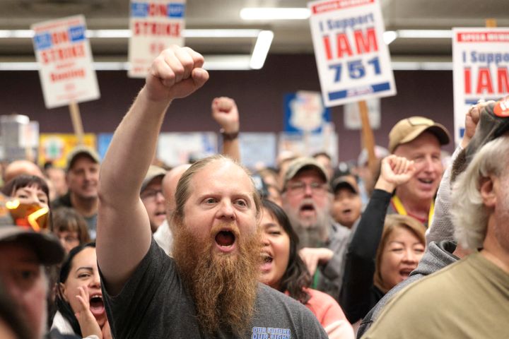 Ryan Bergh, a machinist at Boeing's factory in Everett, Washington, for 10 years, cheers during a strike rally for the International Association of Machinists and Aerospace Workers (IAM) at the Seattle Union Hall in Seattle, Washington, on Oct. 15.