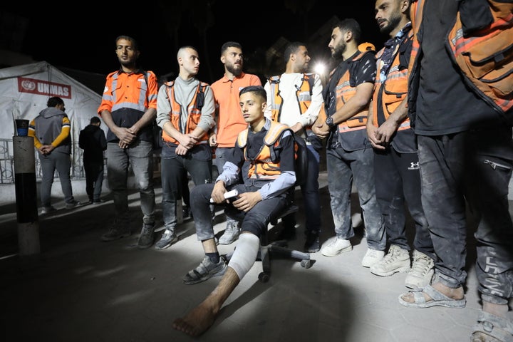 Civil defense workers arrive at Al-Ahli Hospital after being released by Israeli soldiers in Gaza City on Wednesday. The civil defense workers had been detained at a military checkpoint, after soldiers demanded they leave Jabalia in the north.