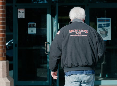 A Boeing Machinist Union member enters the IAM District 751 Union Hall to vote on the latest contract presented by the airline giant after weeks of striking, in Seattle, Washington October 23, 2024. Boeing reported a whopping $6.2 billion quarterly loss Wednesday as a nearly six-week labor strike weighed on its commercial plane division and costly problems dragged down its defense and space business.The embattled aviation giant, which has been under scrutiny from regulators following safety problems, will learn later in the day if Seattle-area employees will accept the company's latest proposal, ending the bruising work stoppage. (Photo by Grant Hindsley / AFP) (Photo by GRANT HINDSLEY/AFP via Getty Images)