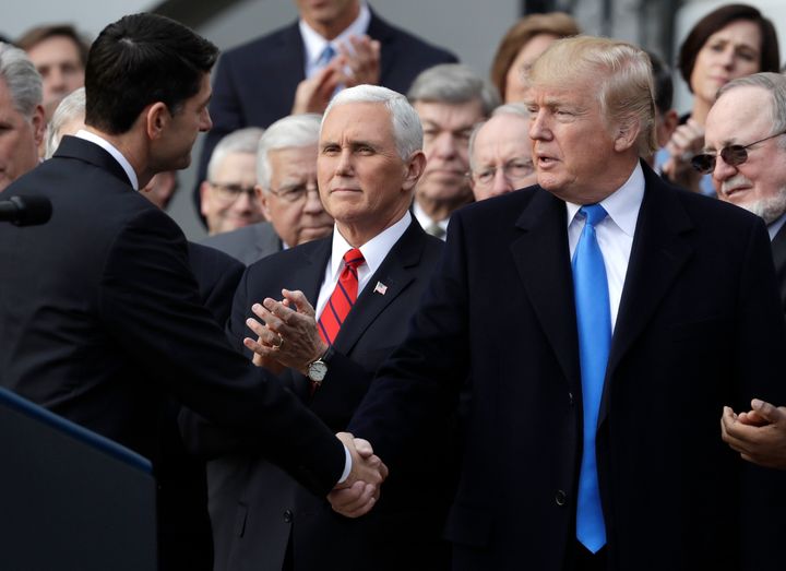 Democrats are closing out their campaign against Donald Trump (shown shaking hands with Paul Ryan when he was speaker of the U.S. House) by painting him as just another Republican, with unpopular stances on taxes, abortion and Social Security.