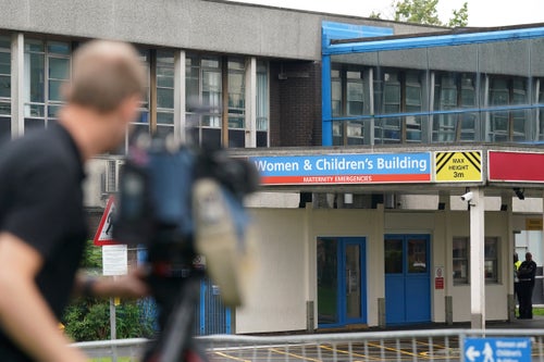 Members of the media outside the Countess of Chester Hospital in Chester, England, Friday, Aug. 18, 2023. British killer nurse Lucy Letby lost her bid Thursday to challenge her conviction for the attempted murder of a baby girl in her care.(Jacob King/Pool photo via AP)