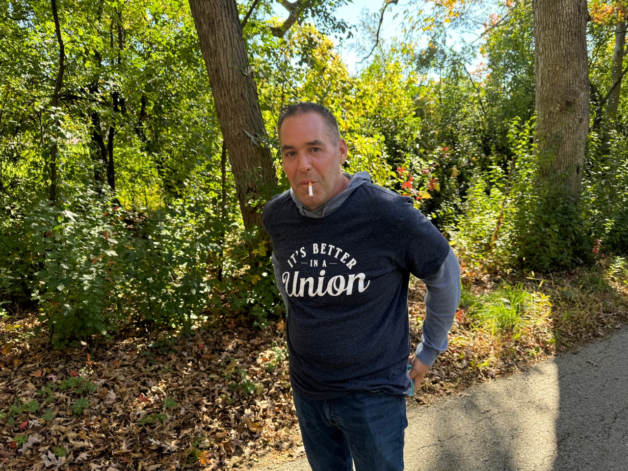 Williams, the IUPAT general president, takes a smoke break between canvassing stops. He goes through about one pack of American Spirit cigarettes a day.