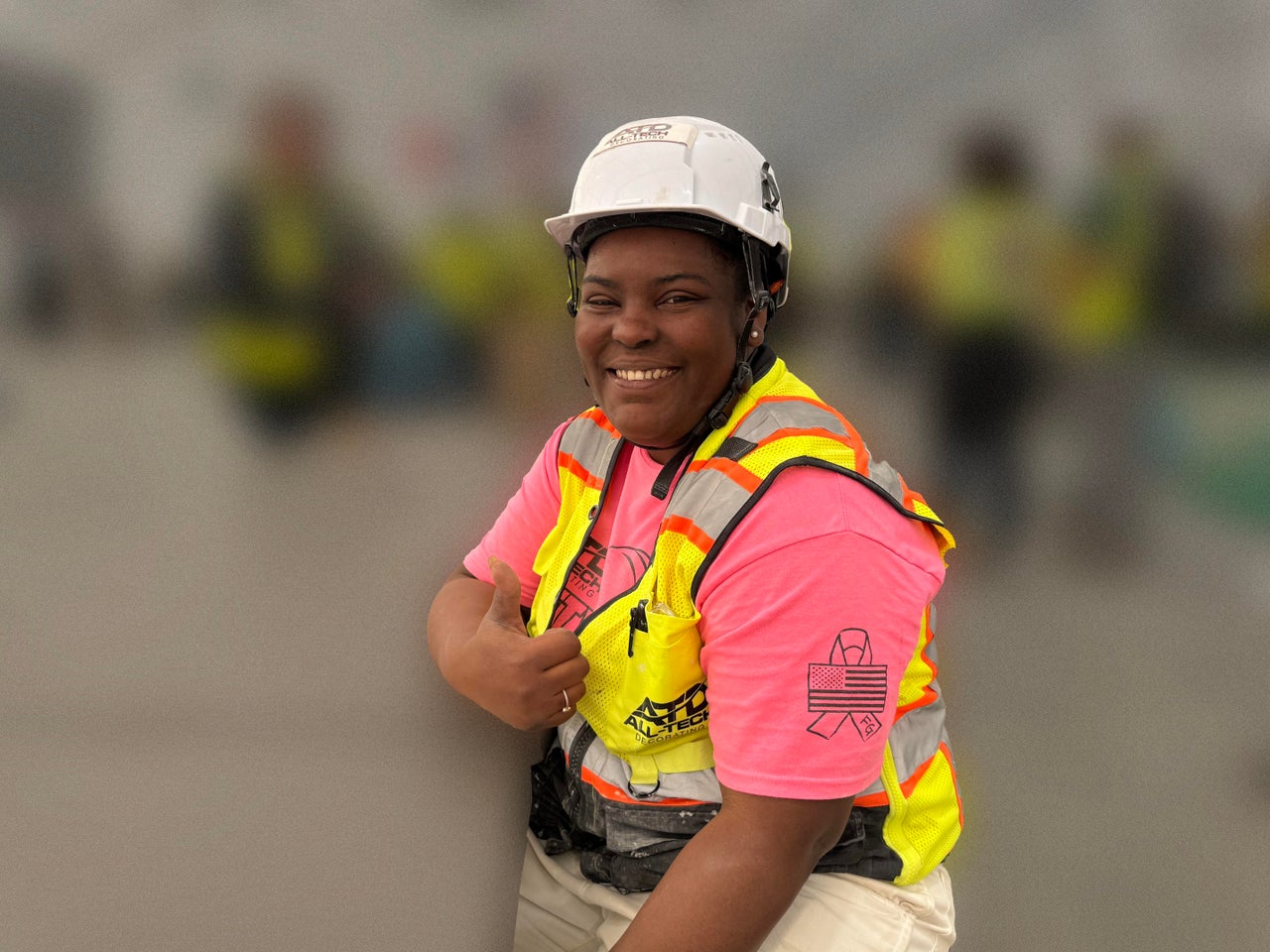 Alesha Smith, a first-year IUPAT apprentice from Racine, Wisconsin, voted for Joe Biden in 2020, but is still undecided this year. The photo is blurry because HuffPost did not have permission to portray the construction site.