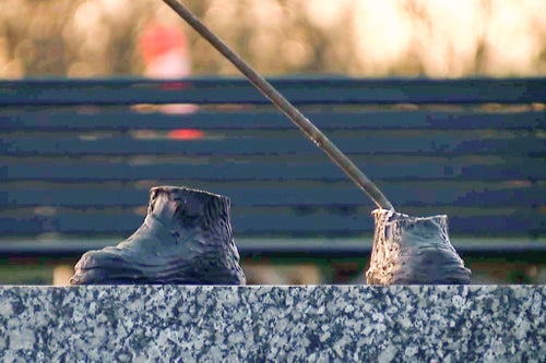 Only the feet are left of a 600-pound bronze statue of a Tuskegee airman after it was stolen from a city park in Detroit on Friday, October 24, 2024. (WXYZ via AP)