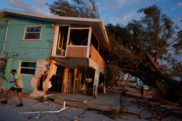 Following Hurricane Milton, Joseph Guindi on Oct. 12 inspects the damage to the two-story beachfront home his family has owned for two decades on Manasota Key, Florida.