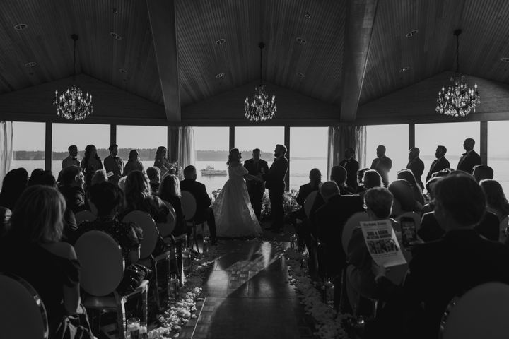 Josh Mankiewicz officiates the wedding of Sara Runnels and her husband Adam at the Edgewater Hotel in downtown Seattle on October 12, 2024.