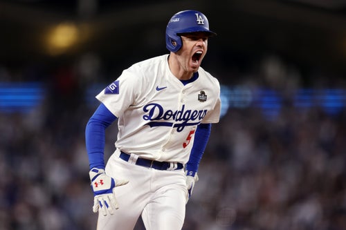 LOS ANGELES, CALIFORNIA - OCTOBER 25: Freddie Freeman #5 of the Los Angeles Dodgers celebrates after hitting a walk-off grand slam during the tenth inning against the New York Yankees during Game One of the 2024 World Series at Dodger Stadium on October 25, 2024 in Los Angeles, California. (Photo by Harry How/Getty Images)