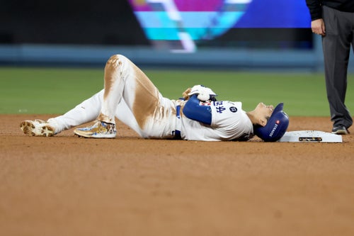 LOS ANGELES, CA - OCTOBER 26, 2024: Los Angeles Dodgers two-way player Shohei Ohtani (17) is injured after stealing to second base in the seventh inning. Game 2 of the World Series against the Yankees at Dodgers Stadium in Los Angeles Friday, October. 25. 2024. (Robert Gauthier/Los Angeles Times via Getty Images)