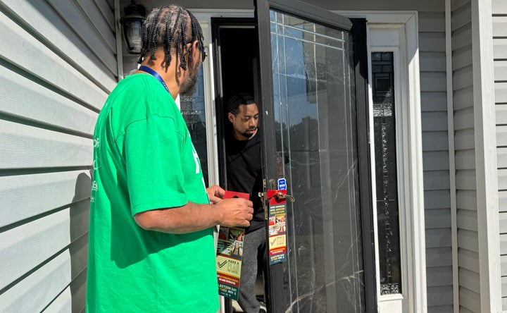 AFSCME member Tracey Thornhill speaks to a voter near Atlanta.