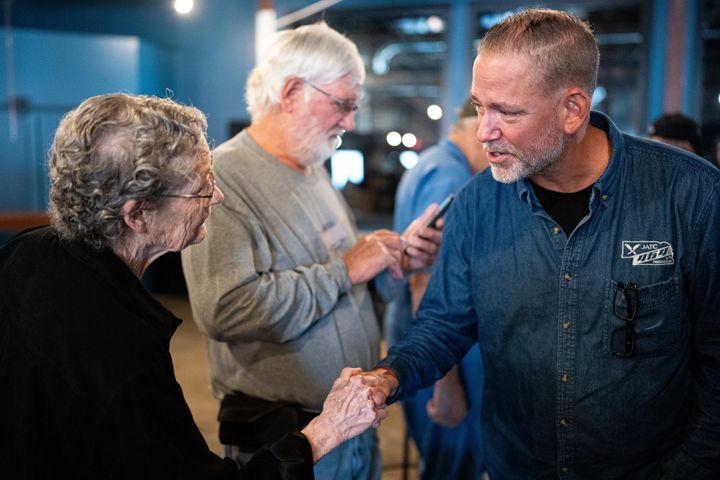 Independent Senate candidate Dan Osborn chats with attendees after speaking during his campaign stop at the Handlebend coffee shop in O'Neill, Nebraska, on Oct. 14.