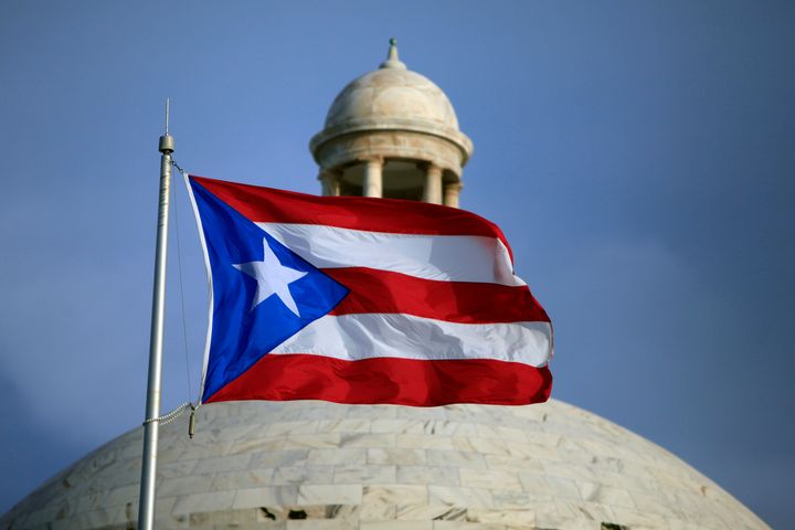 The Puerto Rican flag flies in front of the Capitol building in San Juan, Puerto Rico, July 29, 2015. 