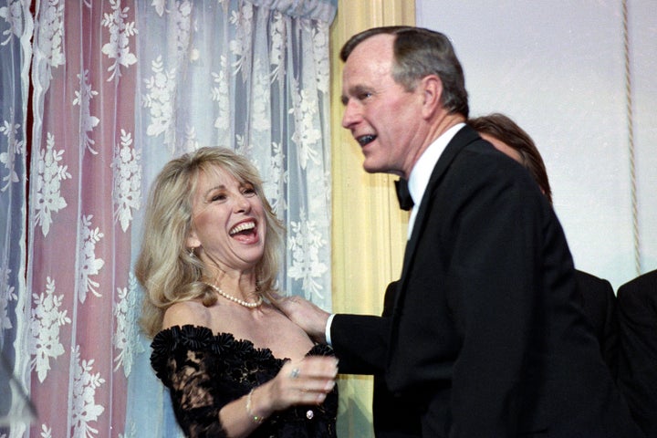 FILE - Actress Teri Garr is all smiles after being kissed by President Bush during a fundraising gala for the historic Ford's Theater in Washington, on March 20, 1991. (AP Photo/Ron Edmonds, File)