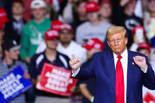 Former President and Republican presidential candidate Donald Trump dances as he leaves the stage after a campaign rally in State College, Pennsylvania.