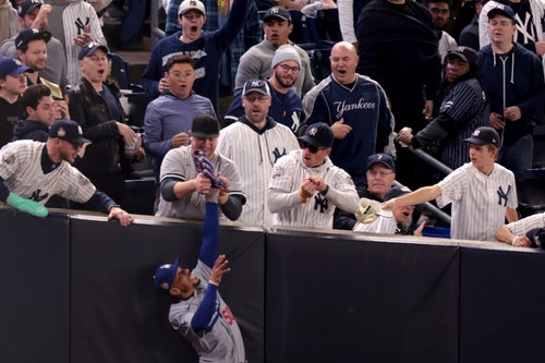 LOS ANGELES, CA - OCTOBER 29, 2024: Yankees Gleyber Torres (not shown) flies out to right fielder Dodgers Mookie Betts in foul territory, on fan interference in the first inning. Game 4 of the World Series against the Yankees at Yankees Stadium in New York City Tuesday, October 29 2024. (Wally Skalij/Los Angeles Times via Getty Images)