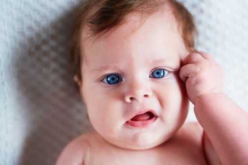 Closeup of a beautiful infant girl lying down