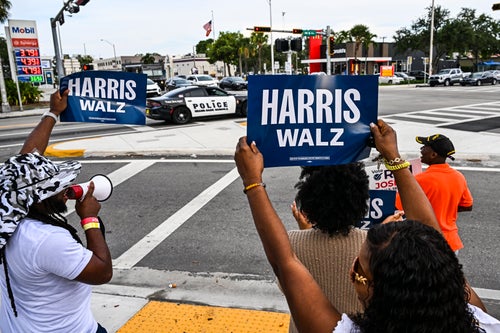 Supporters of Democratic presidential candidate Kamala Harris hold signs and shout slogans in Miami on Aug. 19, 2024.