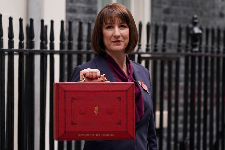 Rachel Reeves holds up the traditional red ministerial box containing her Budget speech yesterday.