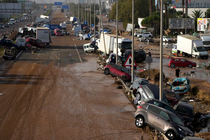 Vehicles are seen piled up after being swept away by floods on a highway in Valencia, Spain.