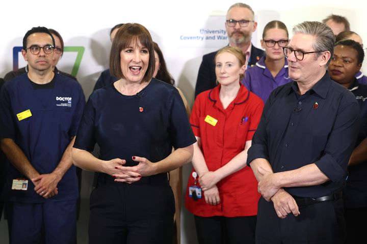 Keir Starmer and Rachel Reeves speak with members of staff at University Hospital Coventry and Warwickshire after the chancellor announced a huge funding boost for the NHS in the Budget.