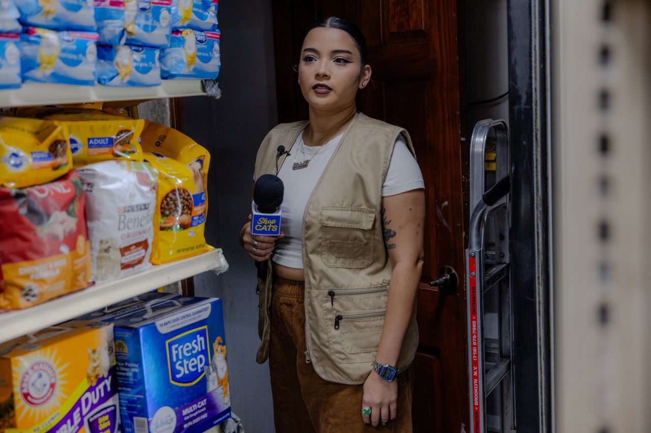 Host Michelladonna looks for a cat at a bodega in Williamsburg, Brooklyn.