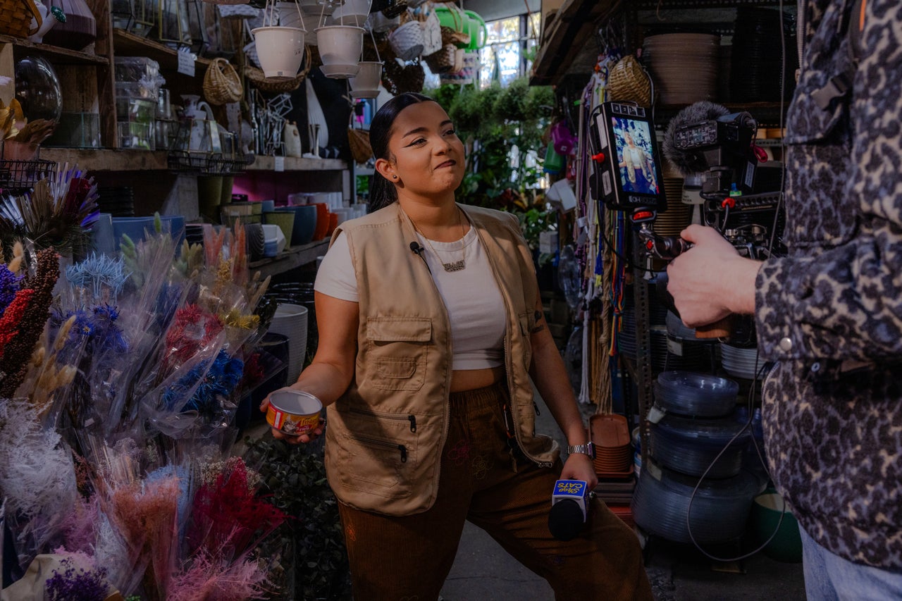 Michelladonna holds up a can of cat food that was unsuccessfully used to lure a cat into the open at a plant shop in Williamsburg, Brooklyn.