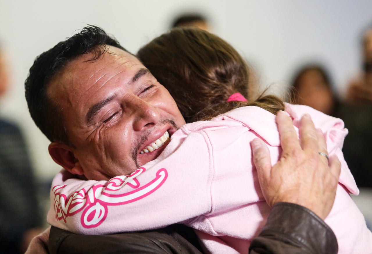 Fernando Arredondo of Guatemala hugs his daughter Alison at Los Angeles International Airport after they were separated during the Trump administration's wide-scale separation of immigrant families.