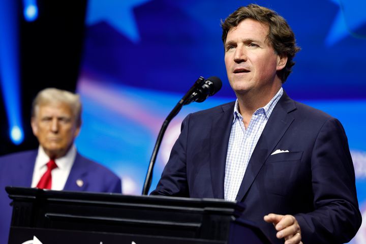 Tucker Carlson speaks alongside Republican presidential nominee, former U.S. President Donald Trump, at a rally in Duluth, Georgia, earlier this month.