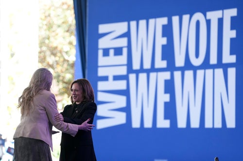 Democratic presidential nominee Vice President Kamala Harris is greeted by Jennifer Bell, as she arrives to speak at a rally at the Coastal Credit Union Music Park at Walnut Creek in Raleigh, North Carolina, on Wednesday.