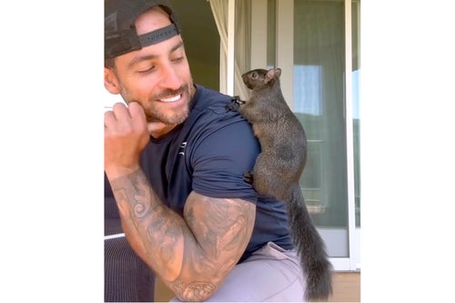 This undated image provided by Mark Longo shows him with his pet squirrel Peanut that was seized by officers from the state Department of Environmental Conservation, at Longo's home in rural Pine City, N.Y., on Oct. 30, 2024.