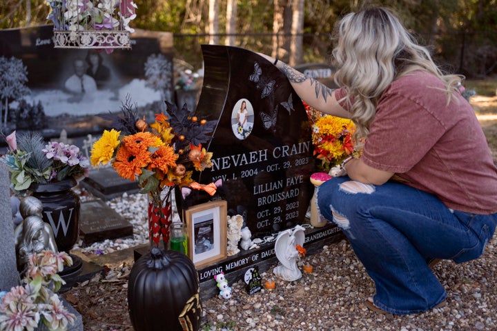 Candace Fails visits the grave of her daughter, Nevaeh Crain, and granddaughter, Lillian Faye Broussard, in Buna, Texas on October 24, 2024. At 25 weeks of pregnancy, Crain passed away on October 29, 2023 from preventable causes, including hemorrhaging, after seeking medical help at various hospitals. (Danielle Villasana for ProPublica)