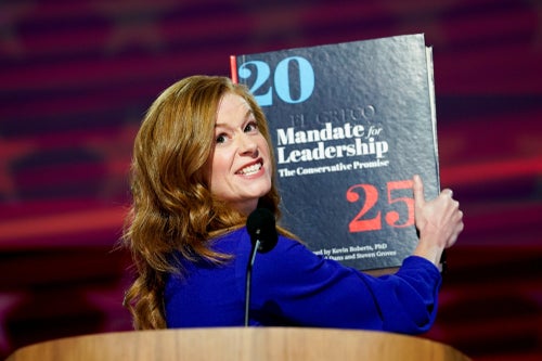 Michigan state Sen. Mallory McMorrow holds up a Project 2025 book during the Democratic National Convention in Chicago on Aug. 19, 2024. During her speech, she warned about the consequences of adopting Project 2025 proposals.