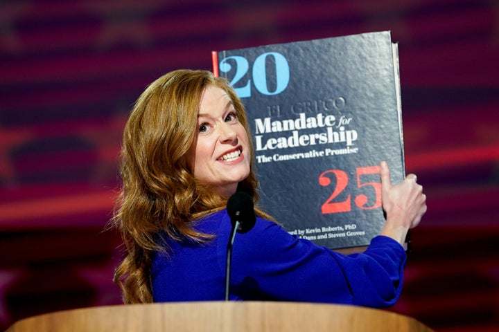 Michigan state Sen. Mallory McMorrow holds up a Project 2025 book during the Democratic National Convention in Chicago on Aug. 19, 2024. During her speech, she warned about the consequences of adopting Project 2025 proposals.