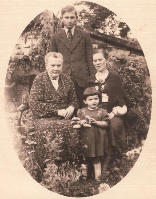 The author's mother, center, in 1945, with Mother Superior Serafia Adela Rosolinska (who received a Righteous Among The Nations medal for hiding the mother's author). The other individuals in the photo are unknown.