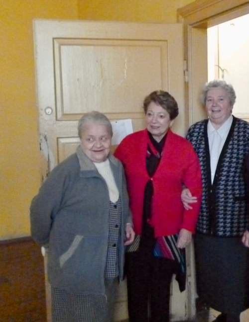 The author's mom (center), Sister Honorata (left), and Sister Zofia touring the old orphanage building in Poland.