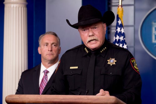 Bill Waybourn, the sheriff of Tarrant County, Texas, is accompanied by Matt Albence, then acting director of Immigration and Customs Enforcement, on Oct. 10, 2019, as Waybourn speaks in the White House Briefing Room.