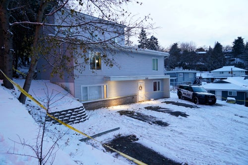 Bare spots are seen on Nov. 29, 2022, in the snowy parking lot in front of the home where University of Idaho students where University of Idaho students Ethan Chapin, Xana Kernodle, Madison Mogen and Kaylee Goncalves were found dead on Nov. 13, in Moscow, Idaho.
