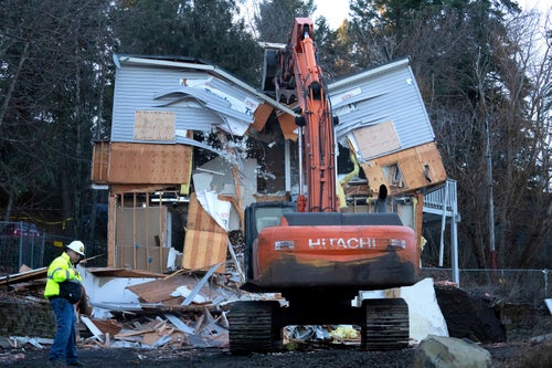 Heavy equipment is used on Dec. 28, 2023, to demolish the house where University of Idaho students Ethan Chapin, Xana Kernodle, Madison Mogen and Kaylee Goncalves were fatally stabbed in November 2022, Moscow, Idaho.