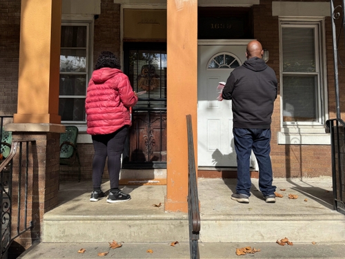 Veronica Bell and Brian Phelps knock doors in the Hunting Park neighborhood of Philadelphia.