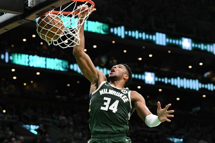 Giannis Antetokounmpo dunks and scores against the Boston Celtics on Oct. 28.