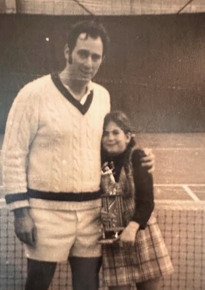 The author (right, age 8, circa 1971) with her father, who had just won a tennis tournament.