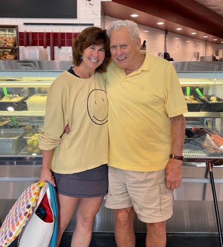 The author with her father at his favorite deli in August 2022, four months before he died.