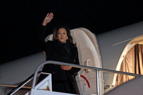 Vice President and Democratic presidential candidate Kamala Harris waves as she boards from Air Force Two at LaGuardia Airport in Queens, New York, on Saturday. 