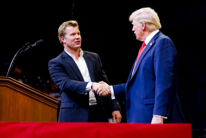 Montana Republican U.S. Senate candidate Tim Sheehy shakes hands with Republican presidential nominee, former U.S. President Donald Trump at a rally at Montana State University on Aug. 9 in Bozeman, Montana.