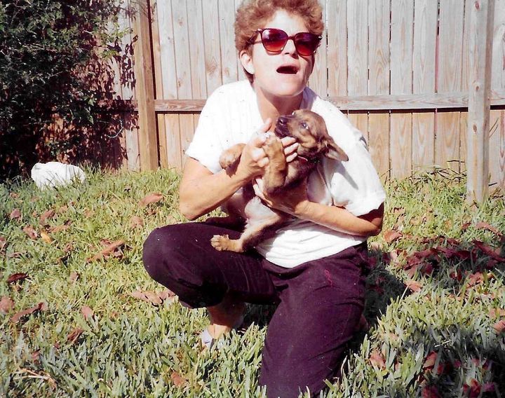 Aunt Carol with Chelsea as a puppy in Miami (date unknown).