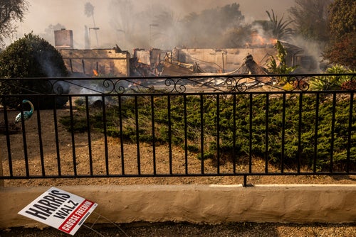 A political sign sits in front of a destroyed home in the Mountain fire, on Nov. 6, 2024, near Camarillo, Calif.