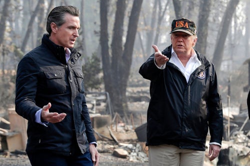 FILE - President Donald Trump talks with then California Gov.-elect Gavin Newsom, left, during a visit to a neighborhood impacted by the wildfires in Paradise, Calif., Nov. 17, 2018. (AP Photo/Evan Vucci, File)
