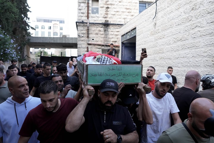 Palestinians hold a funeral procession for 12-year-old Hatim Gays, who was shot dead by Israeli soldiers in the Qalendiya refugee camp north of East Jerusalem, on Oct. 7, 2024.